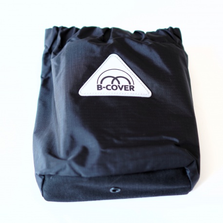 Brompton bicycle cover by Radical Design - cover in saddle bag showing B-Cover logo