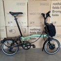 Brompton Electric C Line Explore Mid bar folding bike with rack - Matcha Green - Ex demo