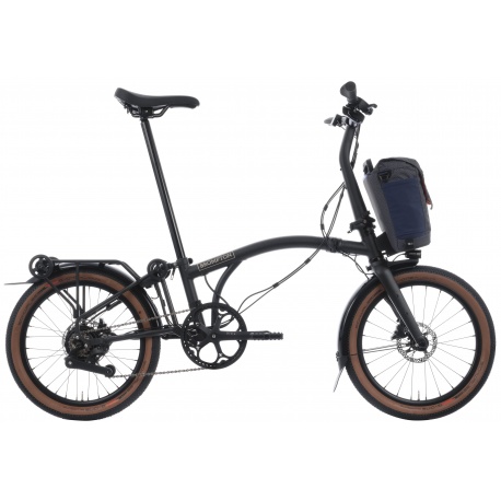 Brompton G Line Electric - M - Black - side view with small bag - stock photo