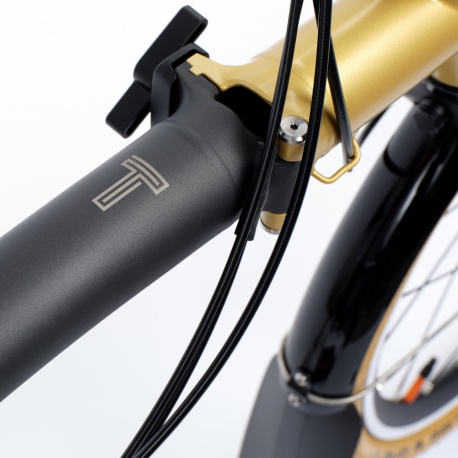 Brompton T Line Ceratech Black/Gold 12-speed - Mid - showing T - stock photo
